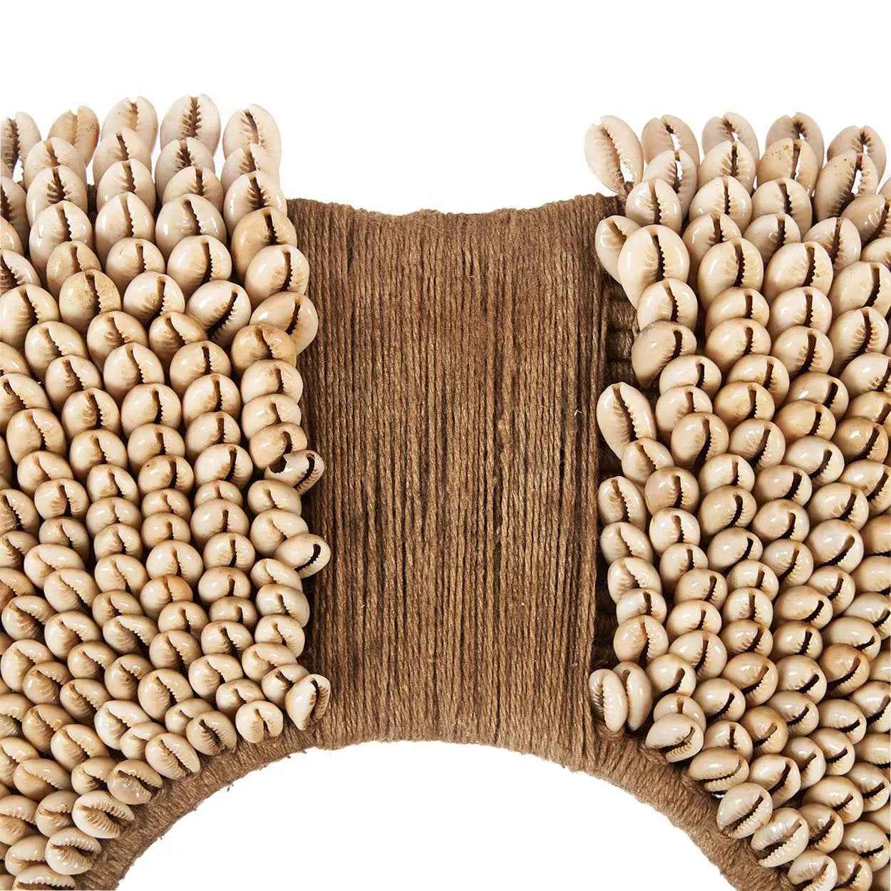 Artful seashell arrangement decor on iron stand