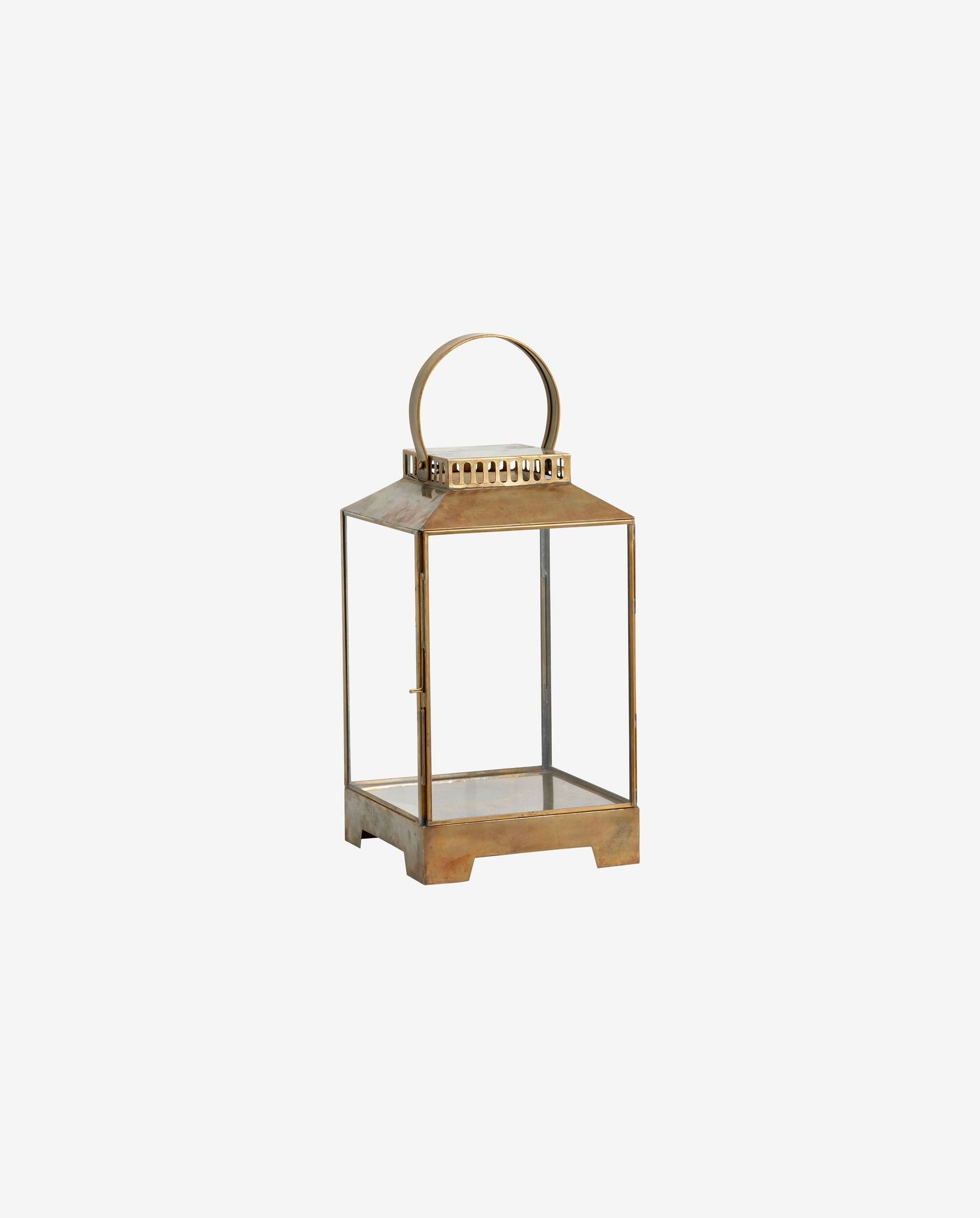 Vintage brass lantern with glass panels and round handle on white background