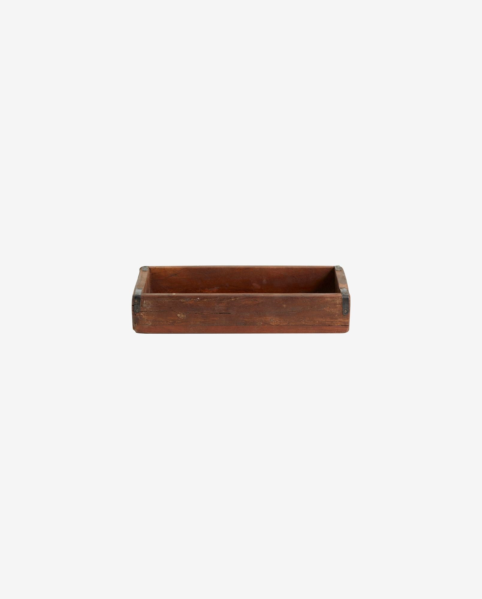 Rectangular vintage wooden tray with metal corner reinforcements on a white background