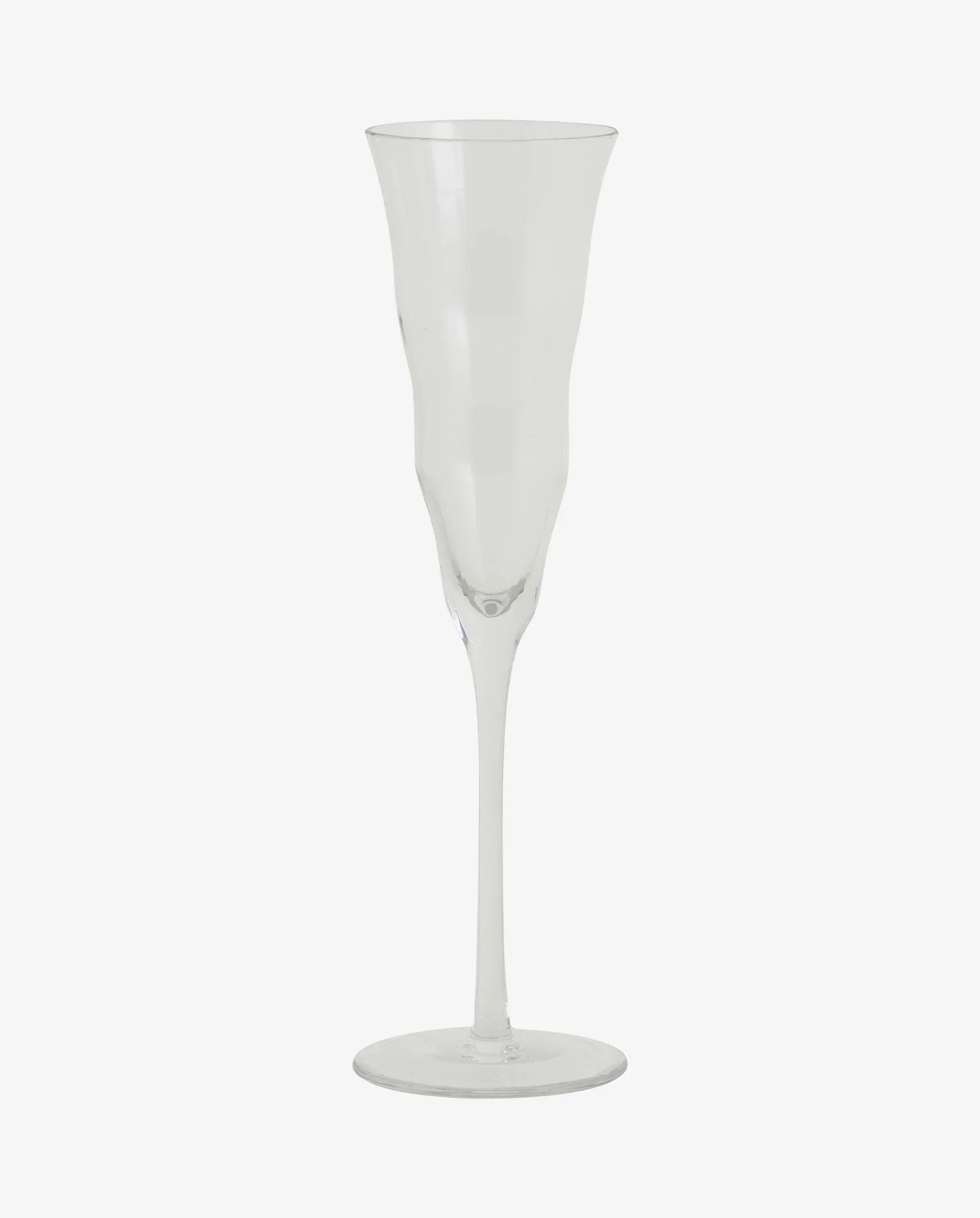 Clear plastic champagne flute with flared rim and slender stem on white background