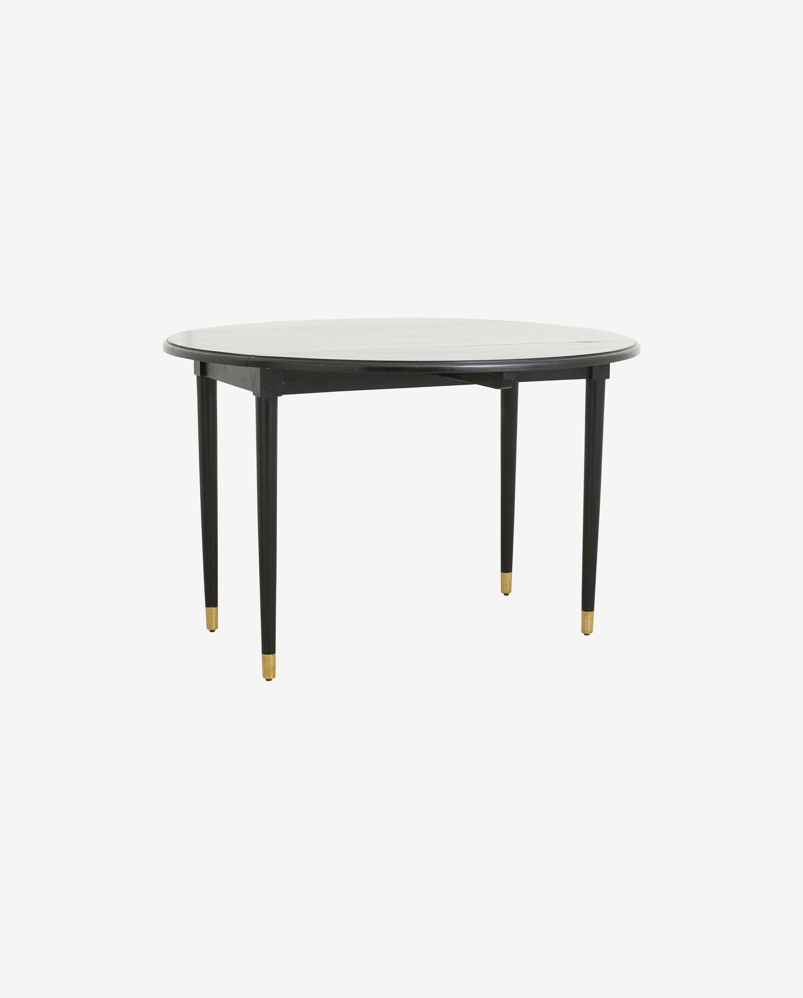 Round wooden table with black legs and gold-capped feet on plain white background
