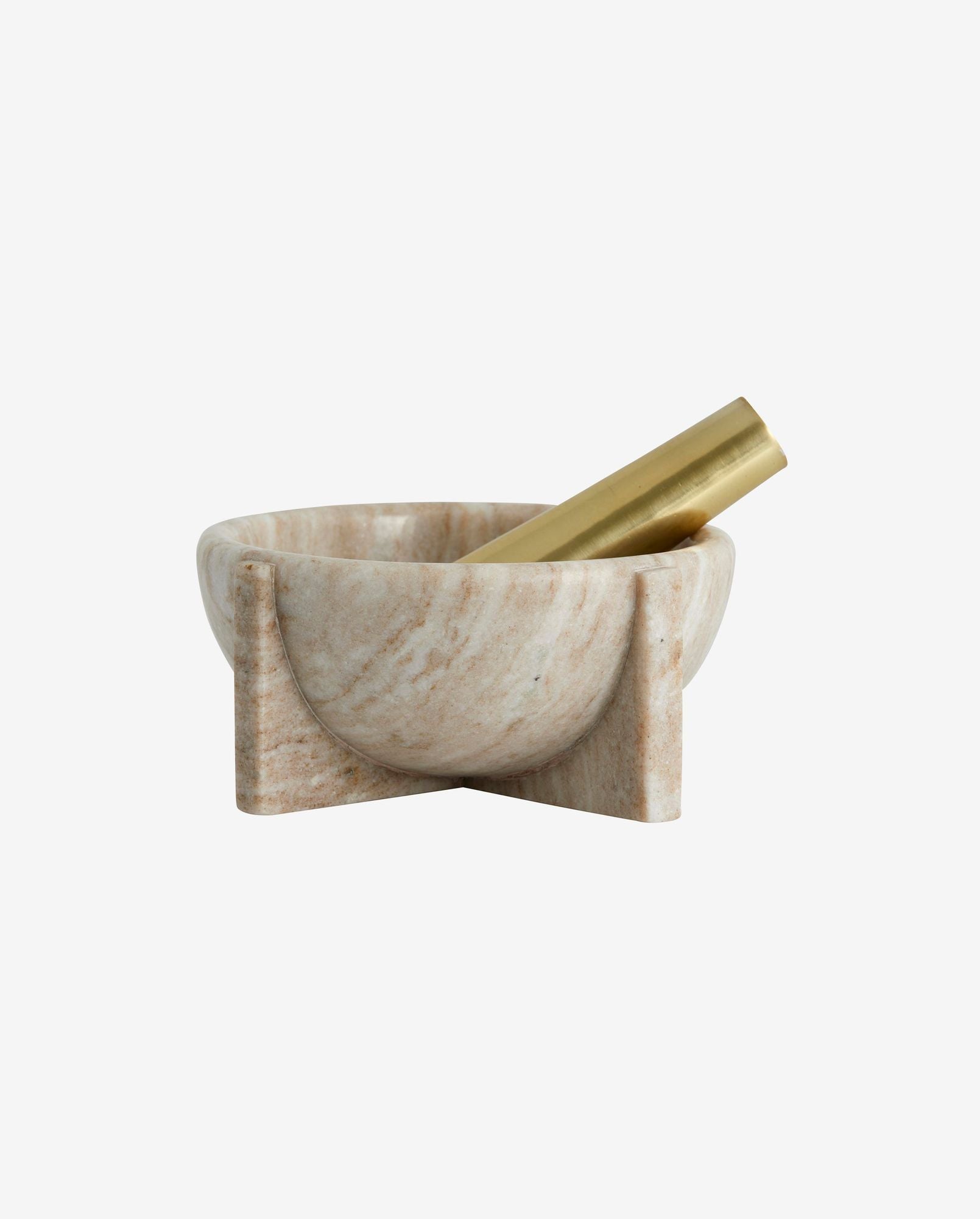 Modern beige marble mortar with a gold brass pestle on white background
