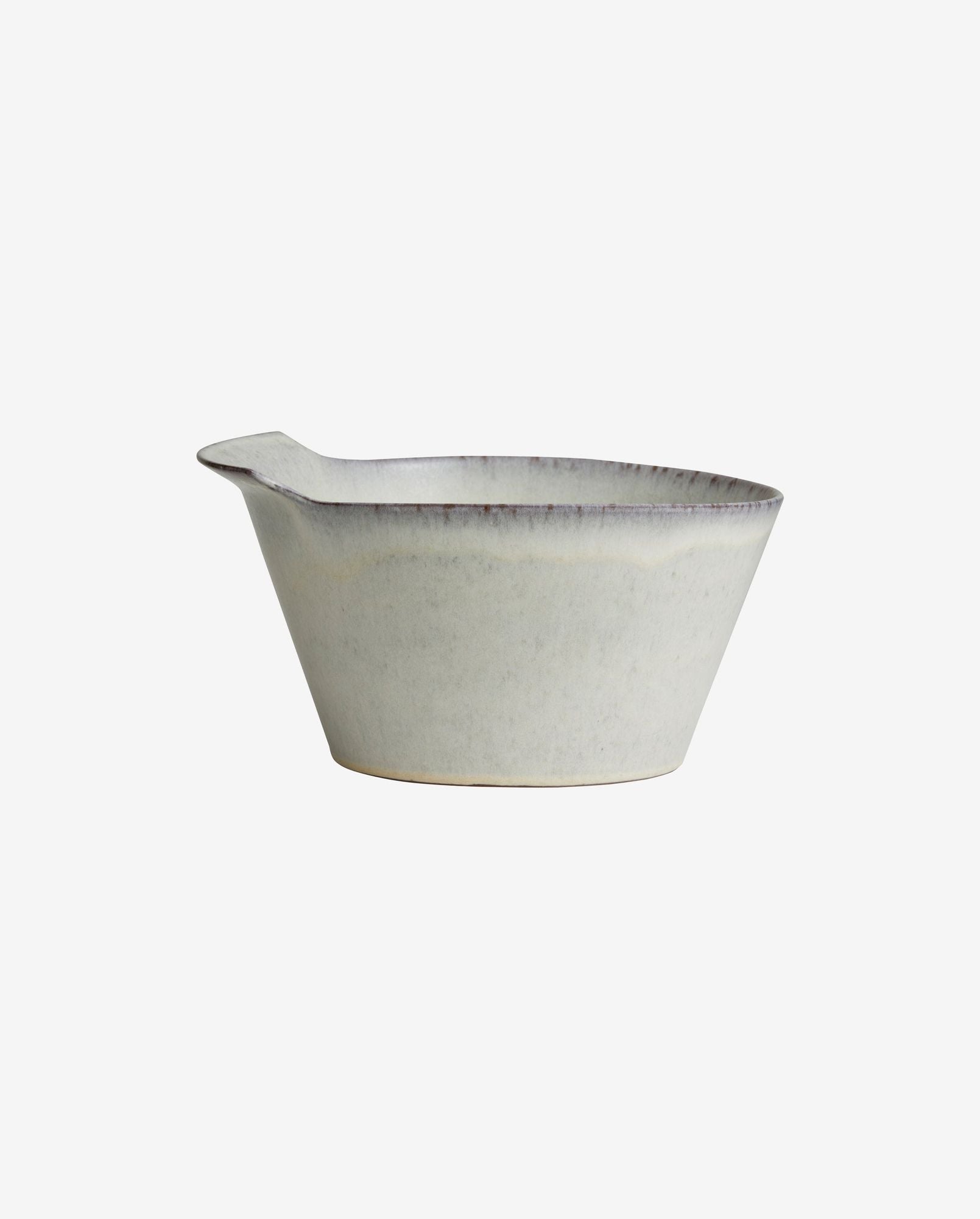 Minimalist ceramic cream-colored pouring bowl with spout and rustic finish