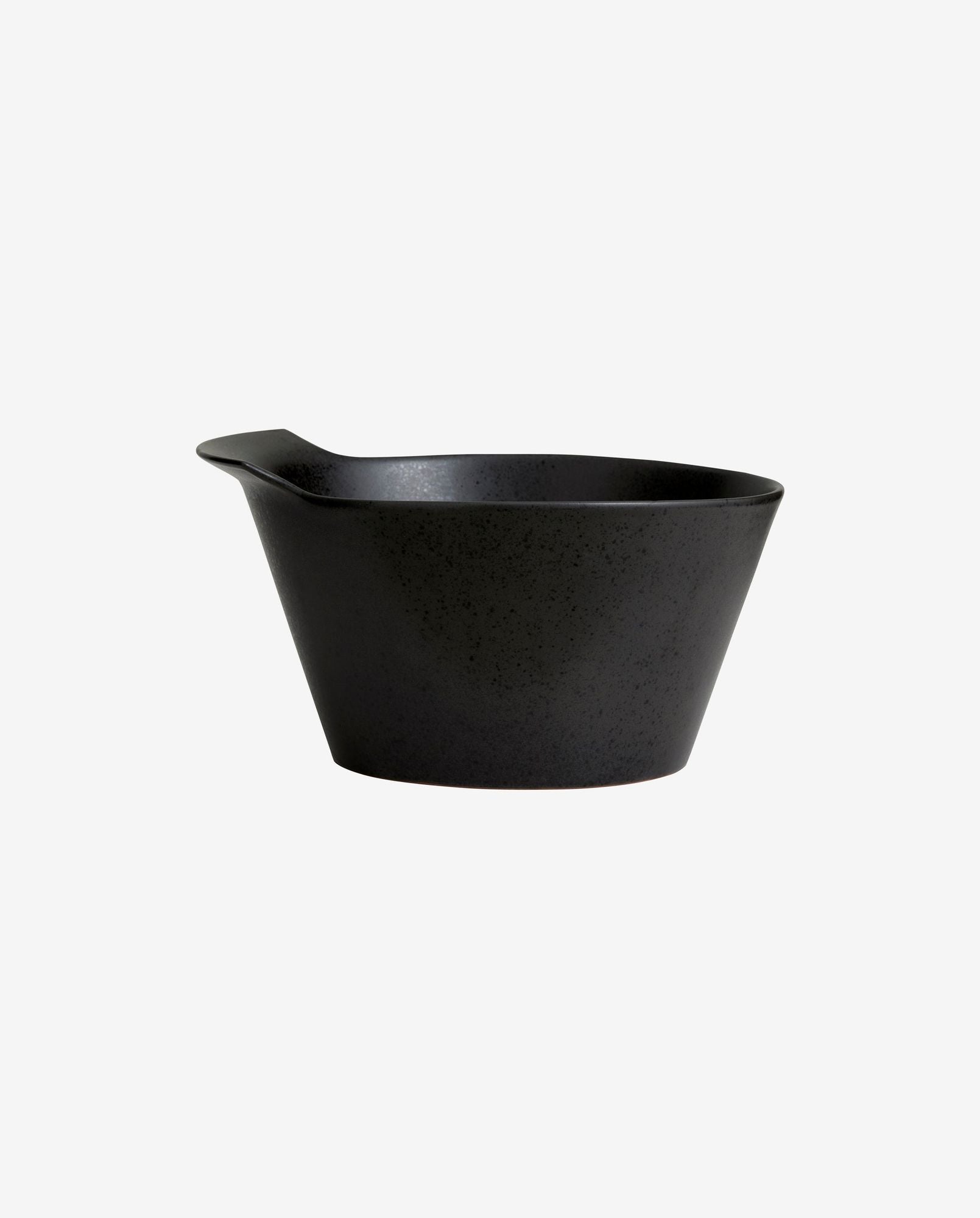 Black speckled ceramic mixing bowl with pouring spout on white background