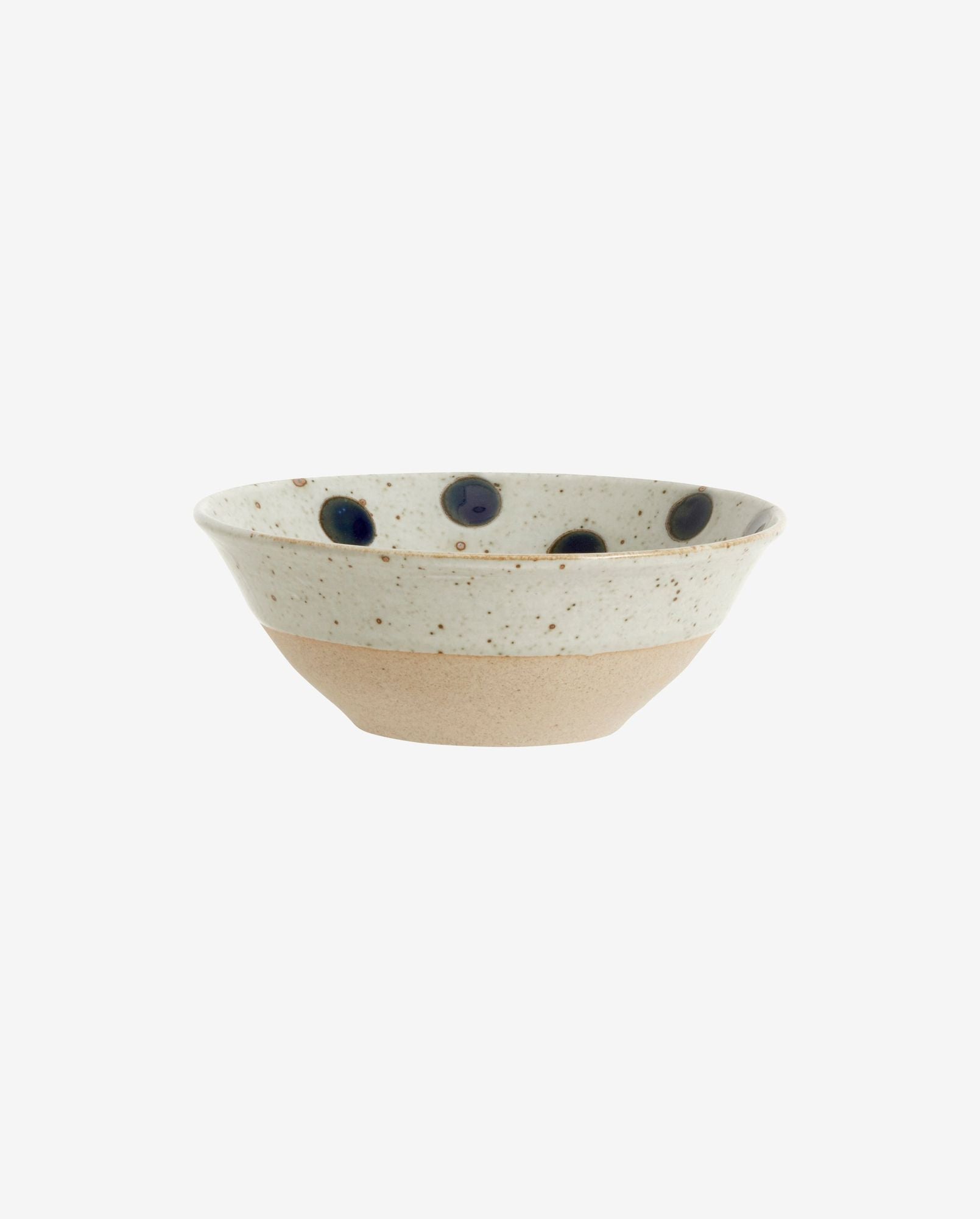 Handmade ceramic bowl with speckled beige and white glaze, decorated with dark blue dots