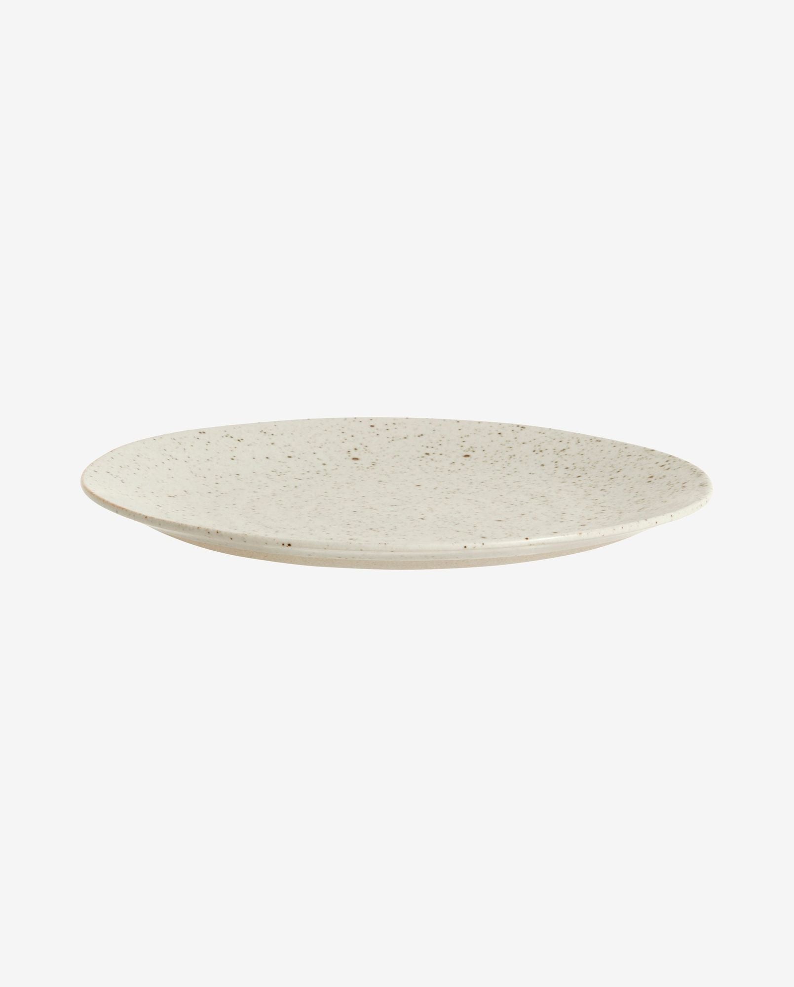 round ceramic plate with speckled beige glaze on white background