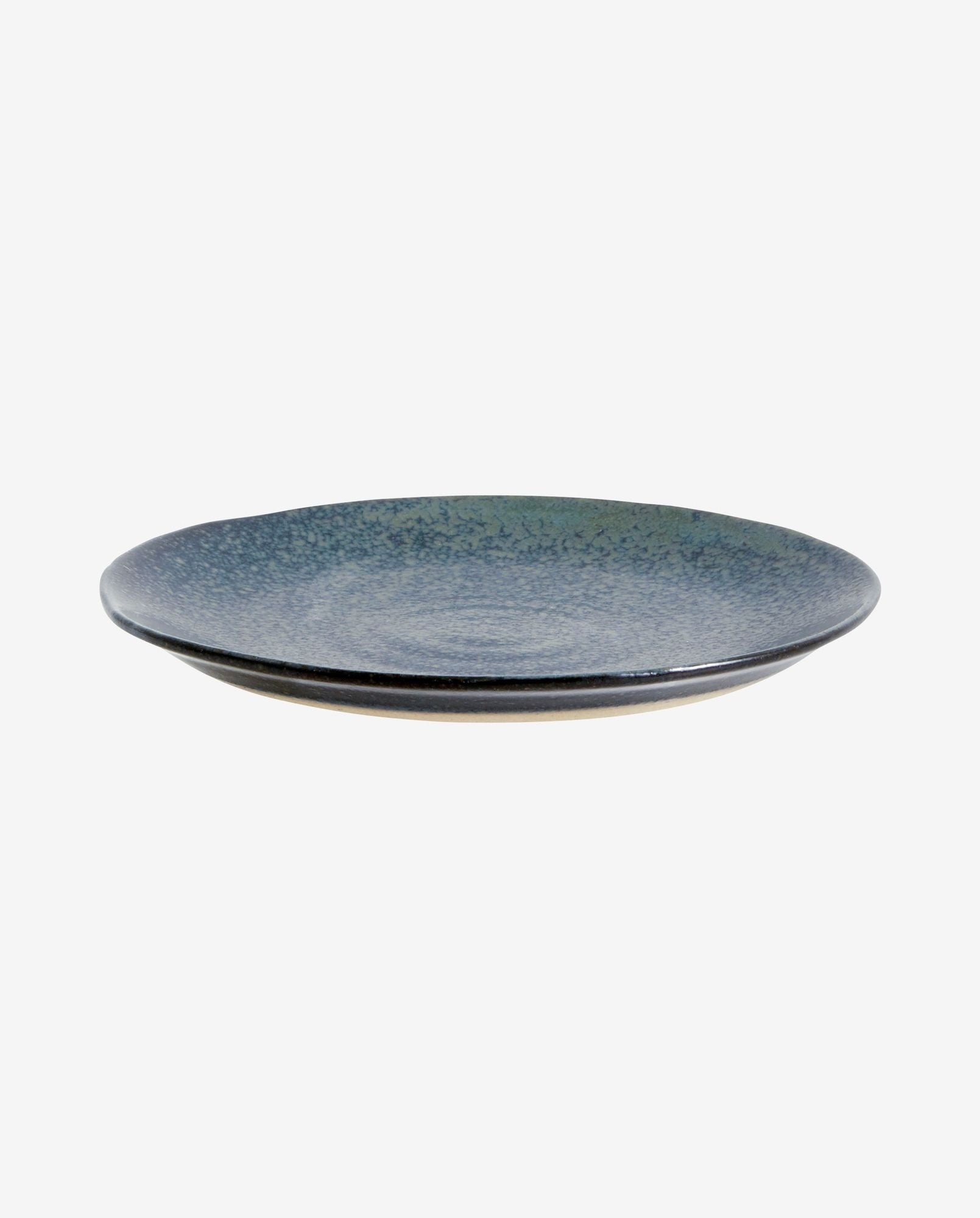 Ceramic blue speckled dinner plate with flat rim on white background