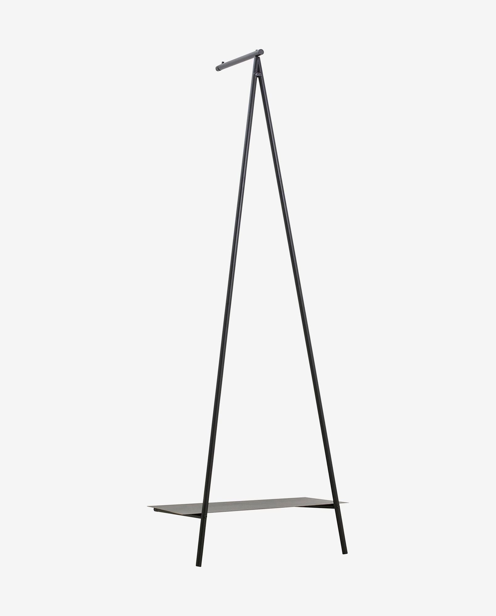 Minimalist black metal tripod clothing rack with lower shelf on white background