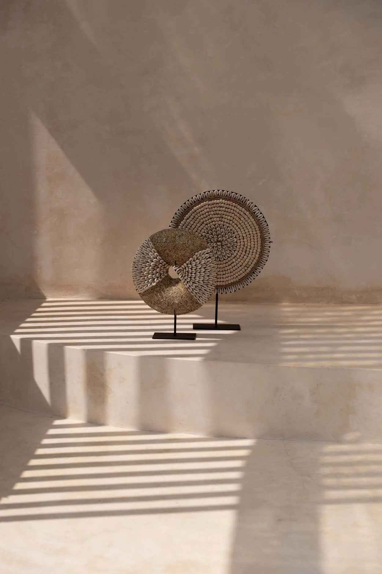 Boho-inspired natural shell ornament on metal base