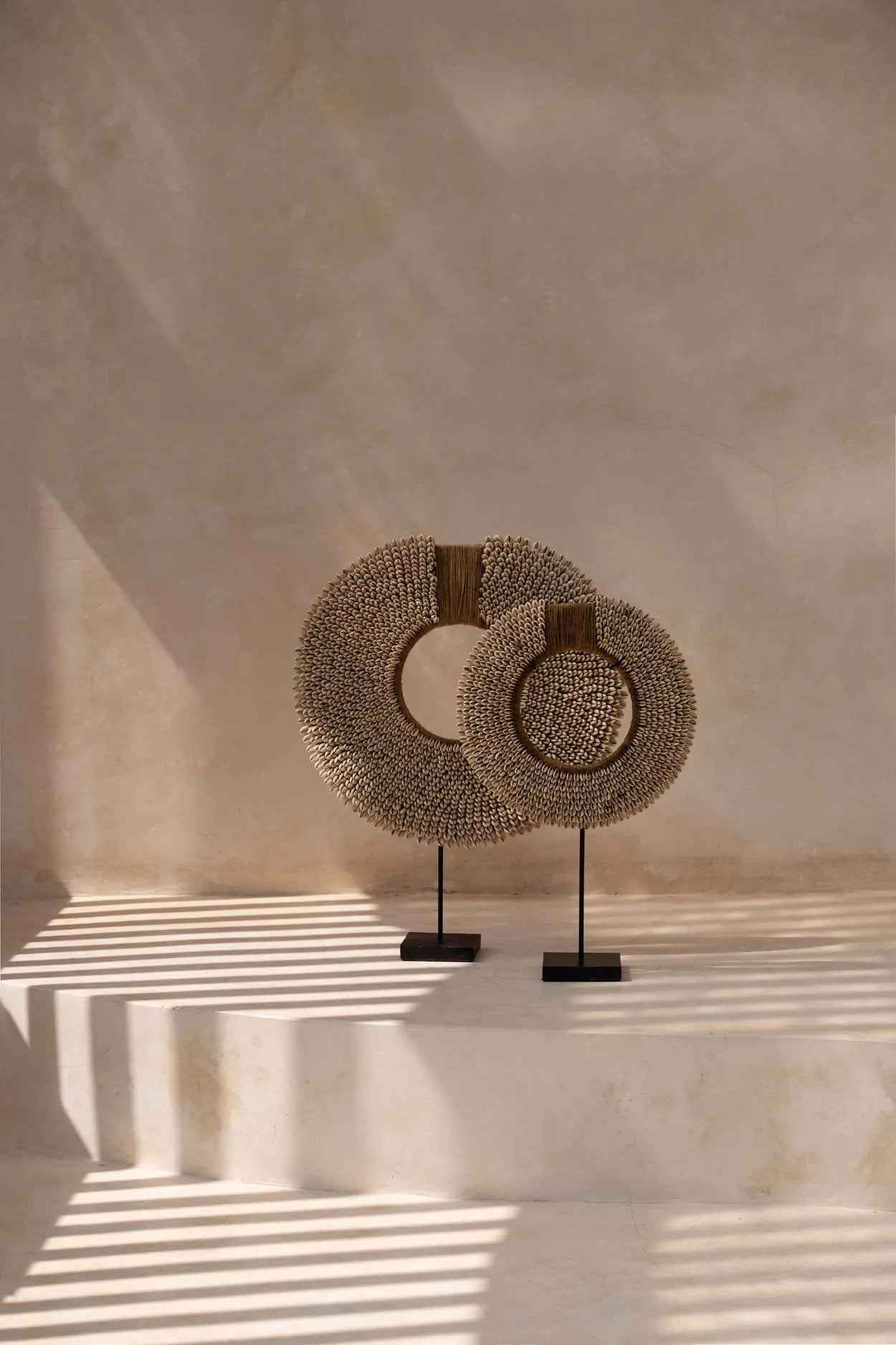 Boho coastal shell ornament on black metal stand