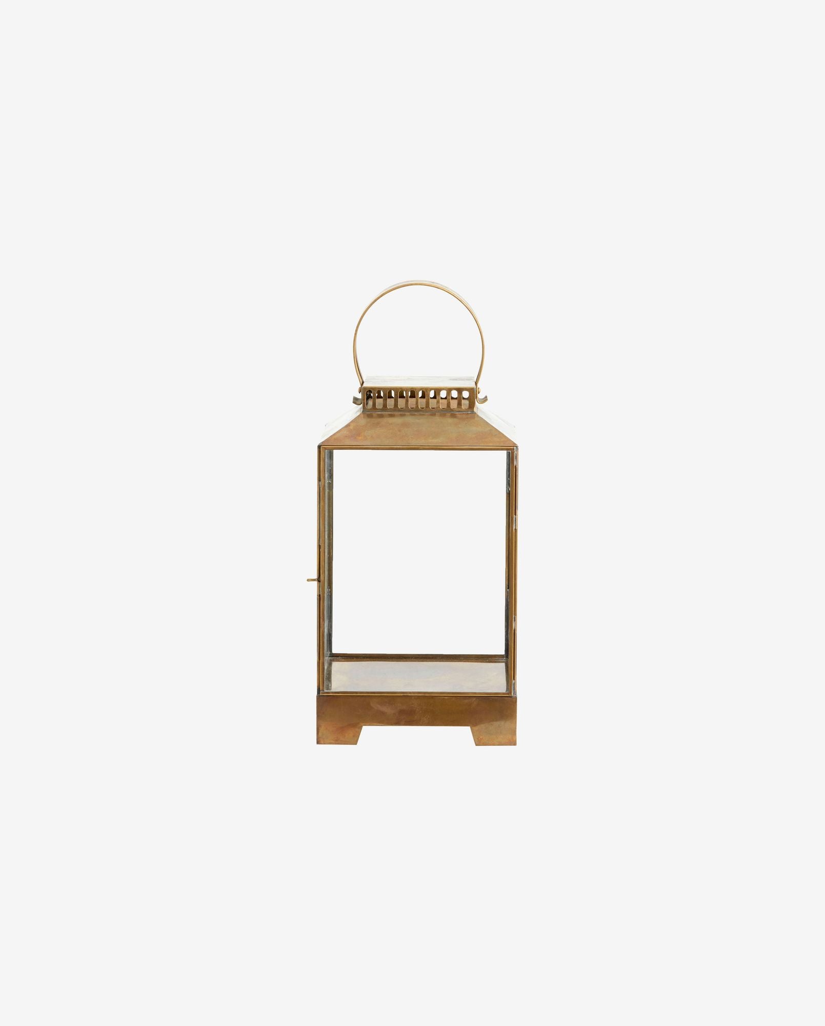 Vintage brass lantern with glass panels and carrying handle on white background
