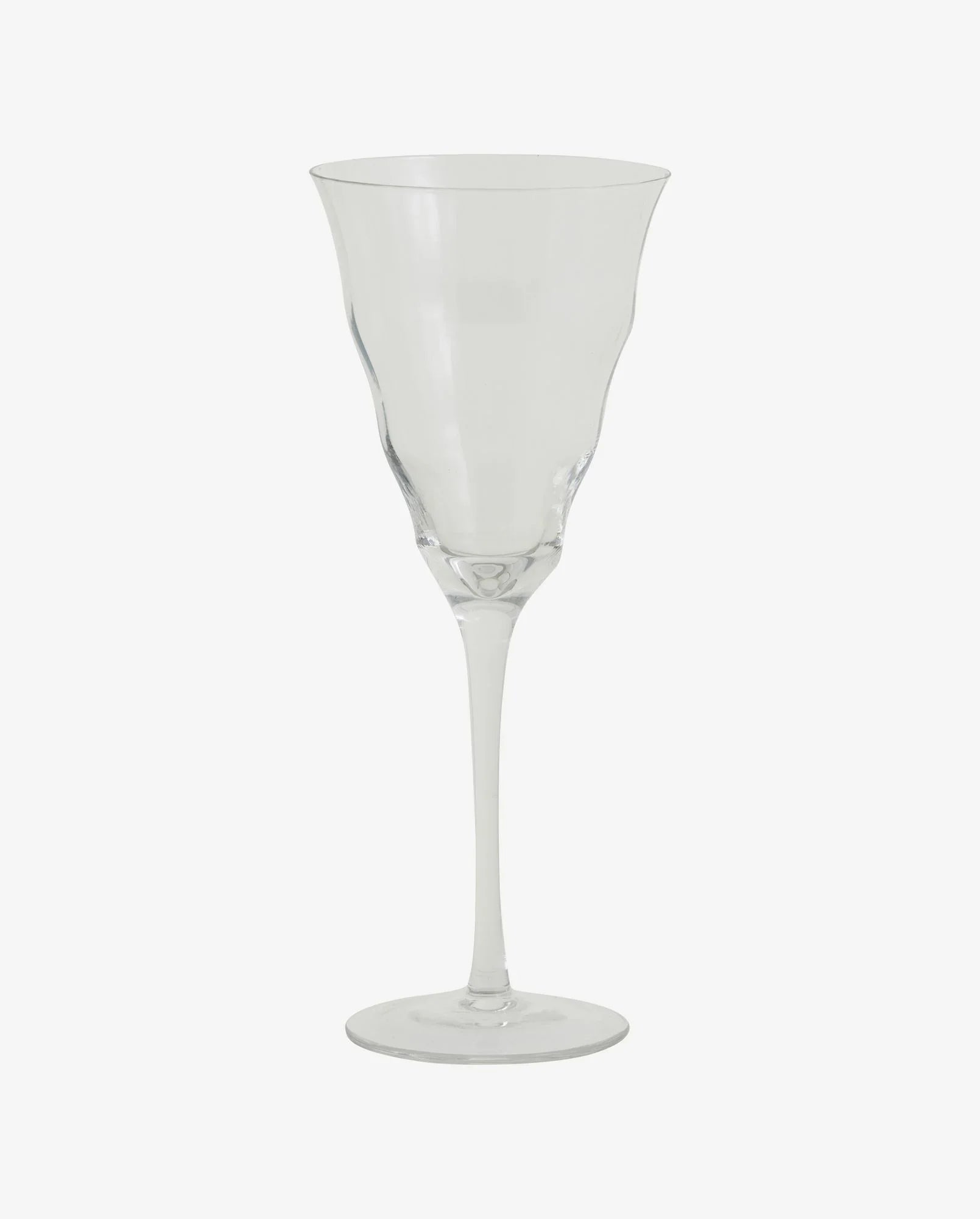 Clear wine glass with a flared rim and slender stem on white background
