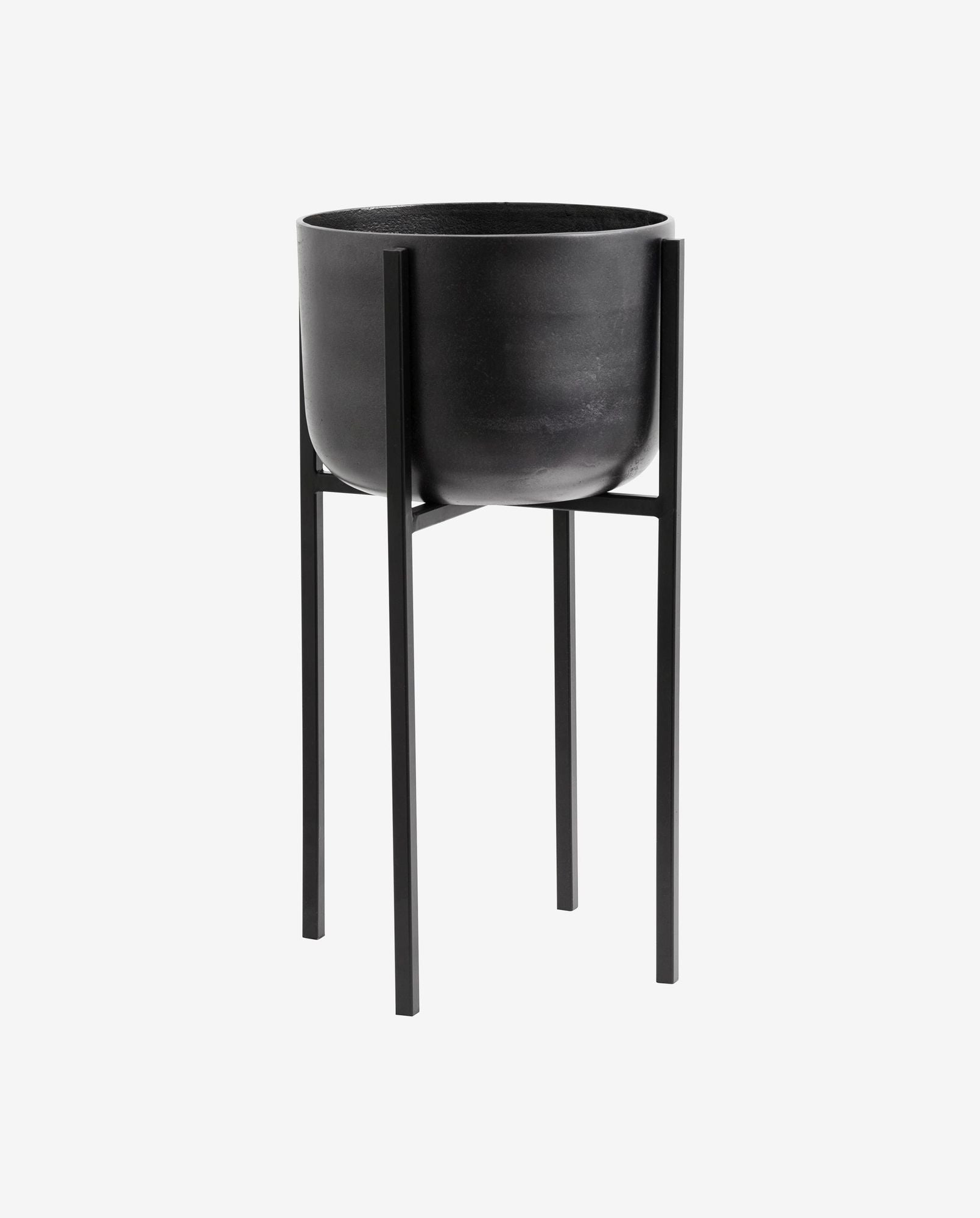 Minimalist black metal planter stand with a matte black round pot on a four-legged frame