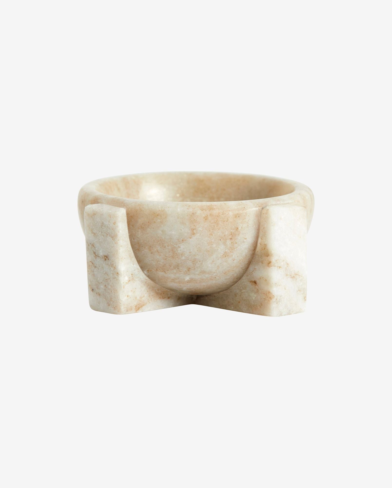 Beige marble bowl with unique curved and angular base design on white background
