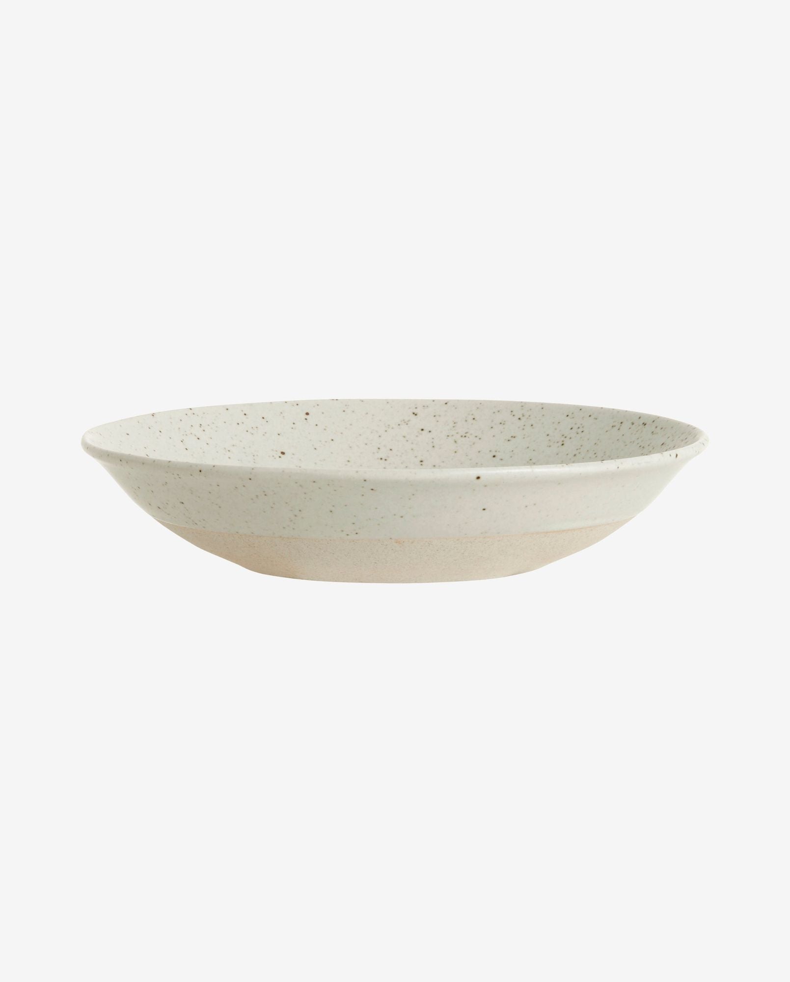 Speckled white ceramic shallow bowl with beige base on white background