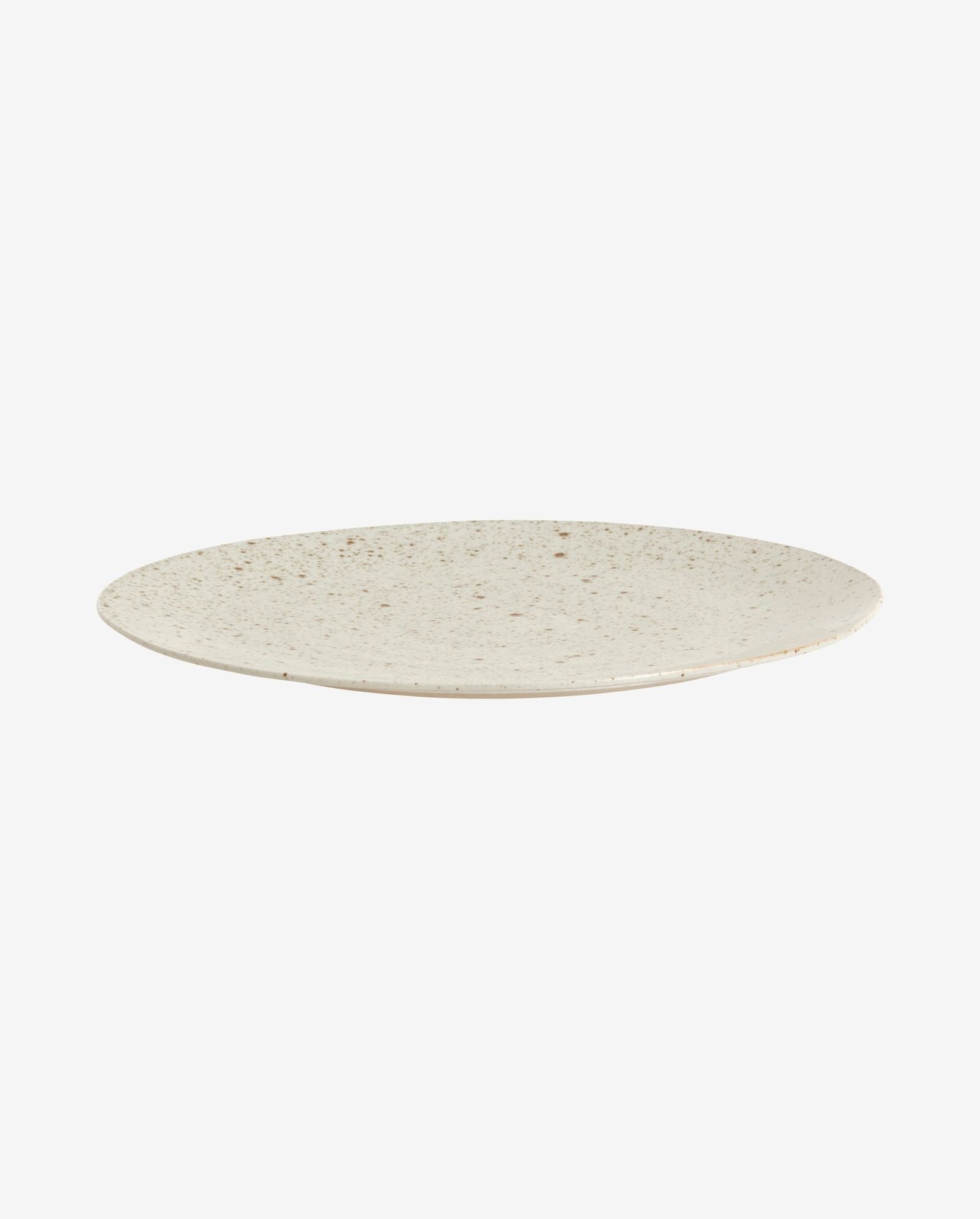 Minimalist ceramic plate with speckled beige glaze on white background