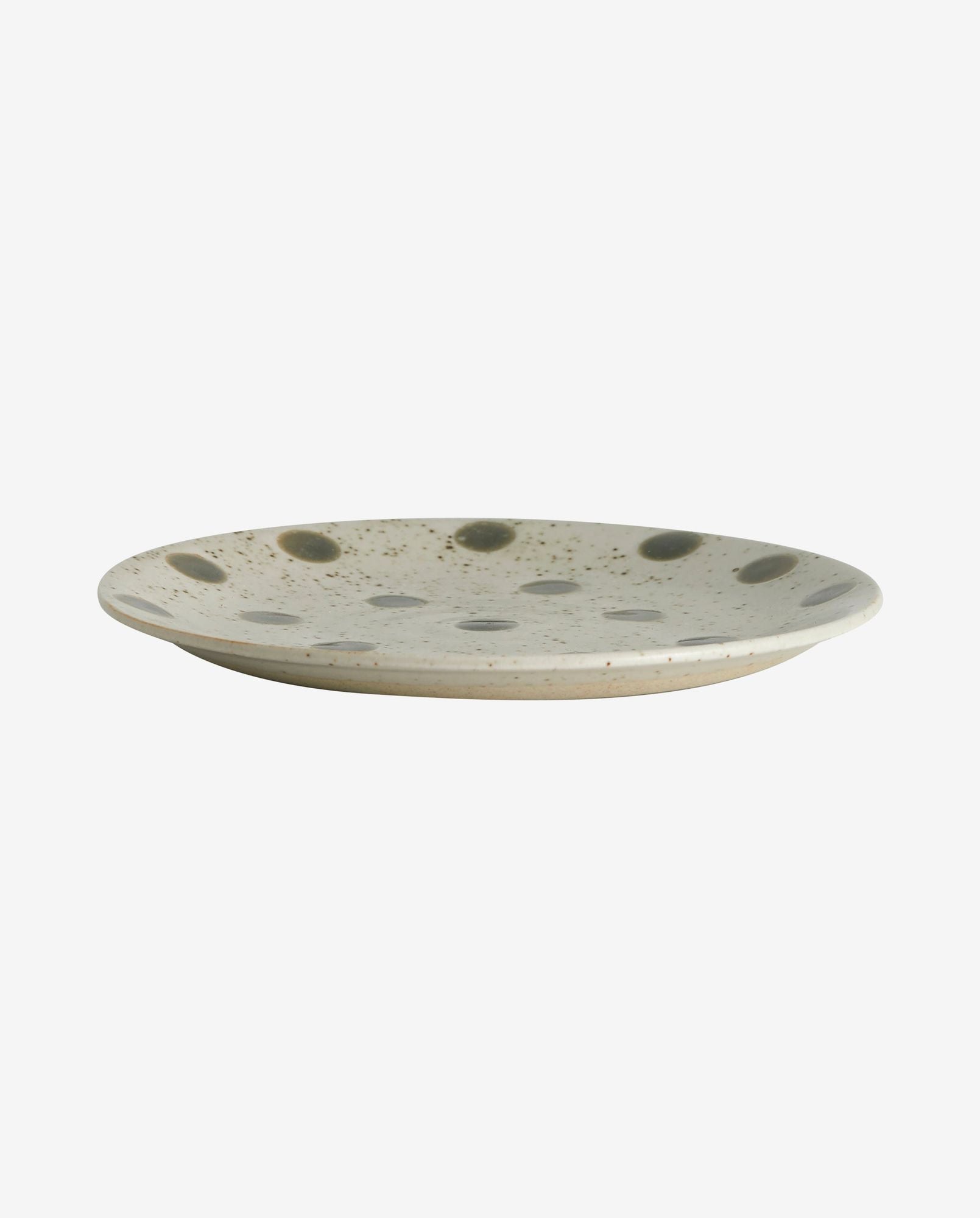 Ceramic plate with gray polka dots and speckled design on a white background