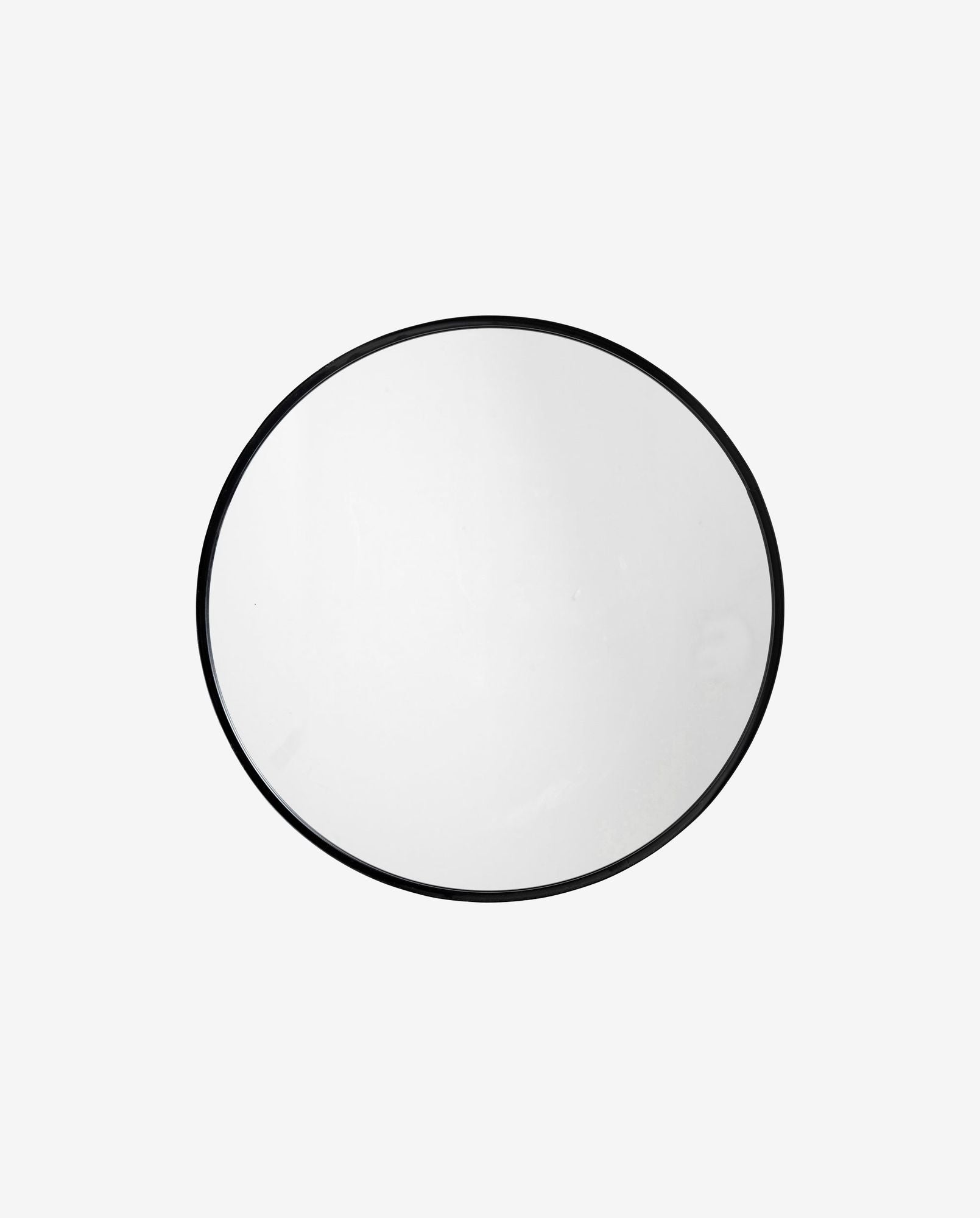 Round wall mirror with thin black metal frame on a plain white background