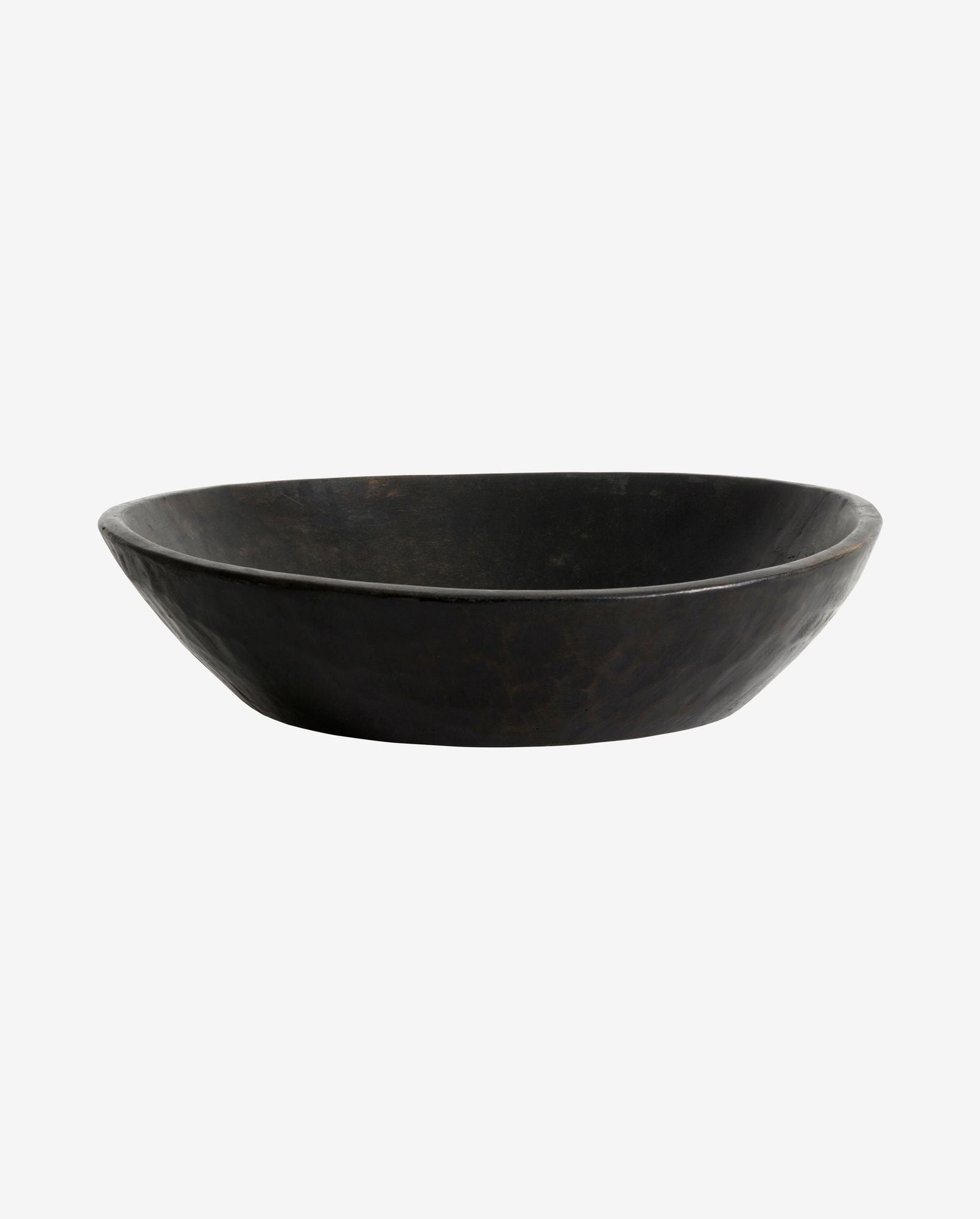 Hand hammered dark metal decorative shallow bowl with a rustic finish