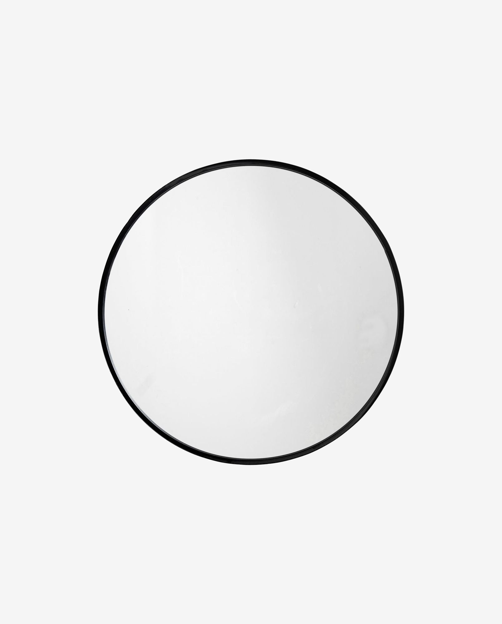 Round wall mirror with a thin black metal frame on a light gray background