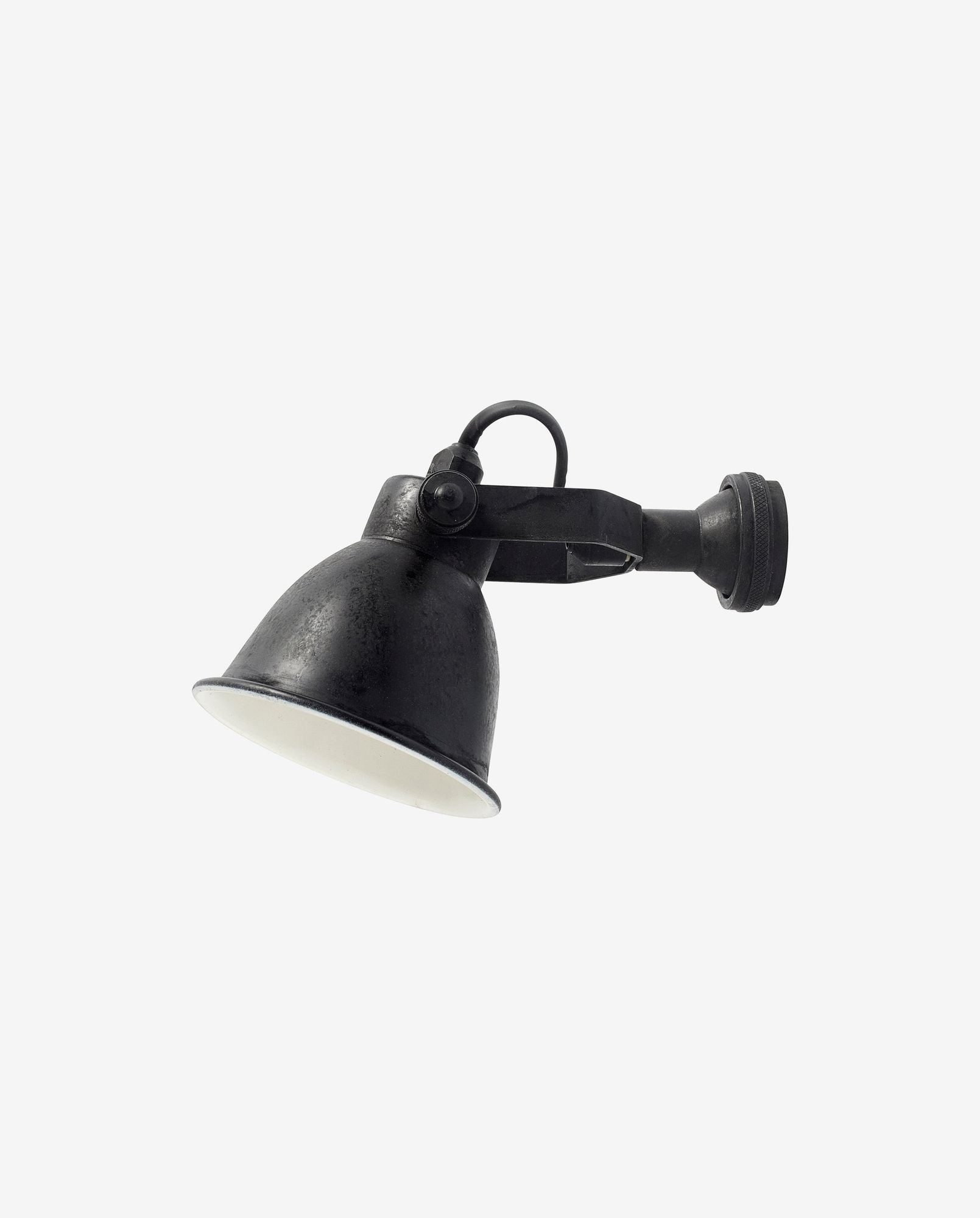 Black adjustable metal wall-mounted spotlight with white interior against white background